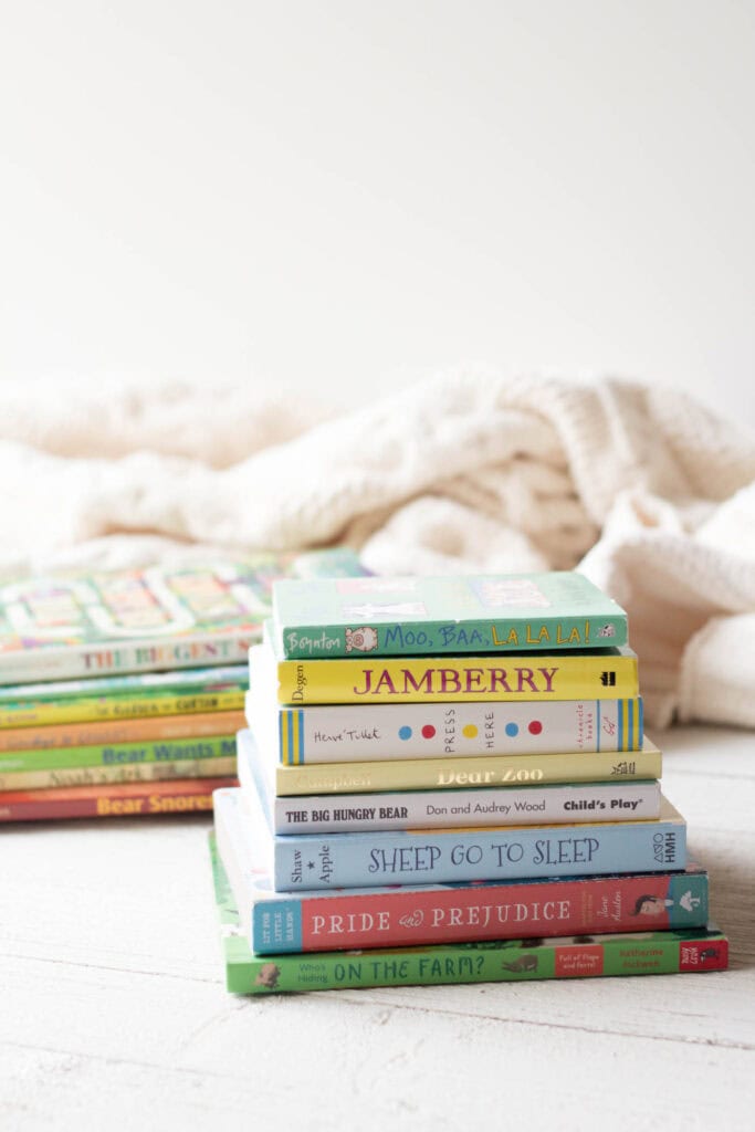 Stacks of colorful children's board books.