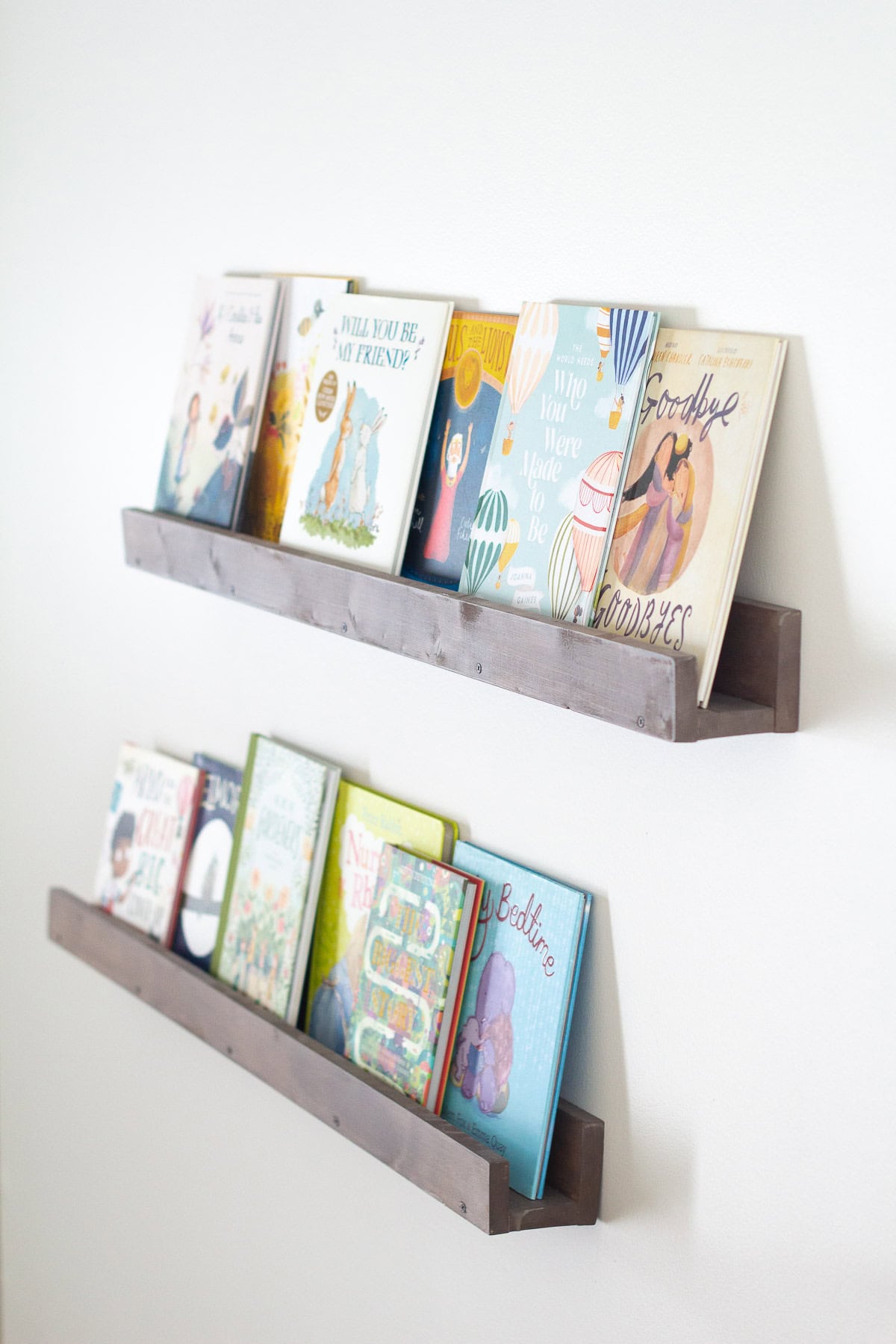Ledge shelves filled with forward-facing displays of children's picture books.