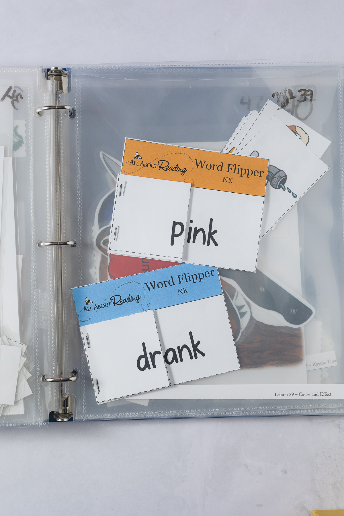 "Word Flipper" activities from All About Reading in a plastic sheet protector.